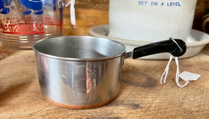 Very small (one cup) Revere copper-bottom pot